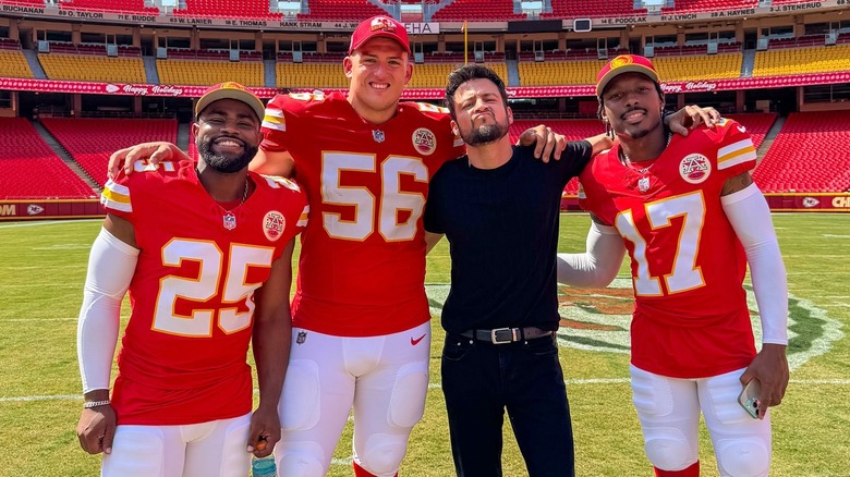 Tyler Hynes posing with Chiefs players