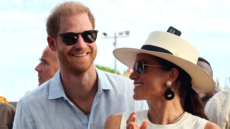 Prince Harry and Meghan Markle smiling