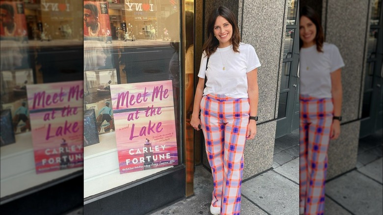 Carly Fortune at a book store with "Meet Me at the Lake"