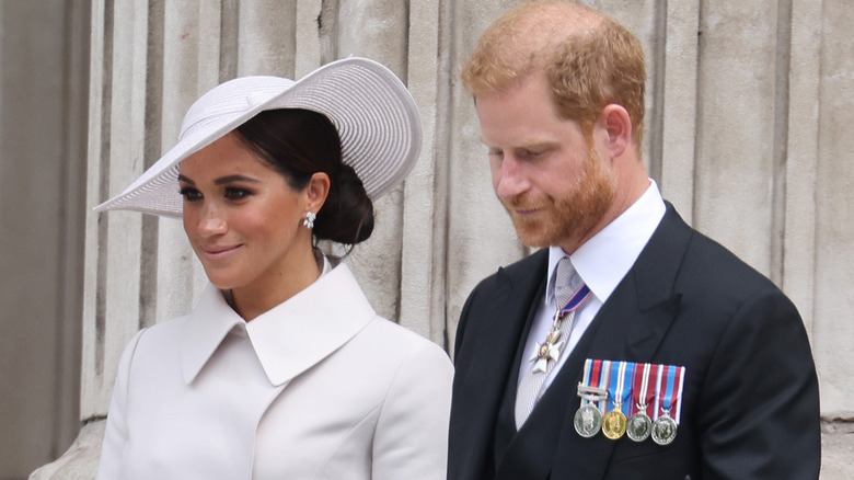 Meghan Markle and Prince Harry walk side by side