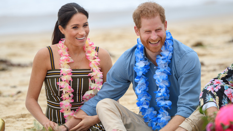 Meghan Markle and Prince Harry laughing on the beach in Australia