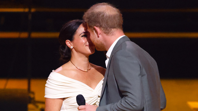 Meghan Markle and Prince Harry share a kiss