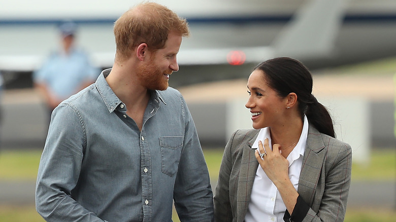 Prince Harry and Meghan Markle looking at each other