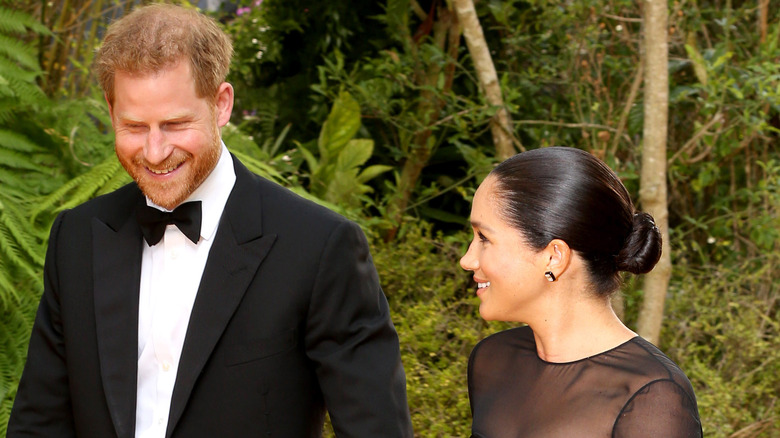 Meghan Markle smiling at Prince Harry