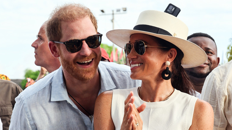 Prince Harry and Meghan Markle smiling