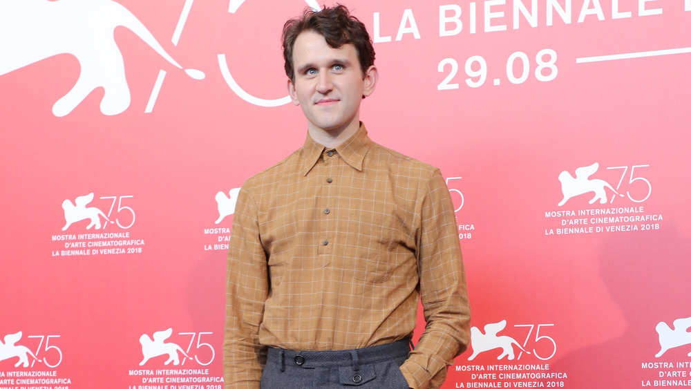 Harry Melling poses on the red carpet