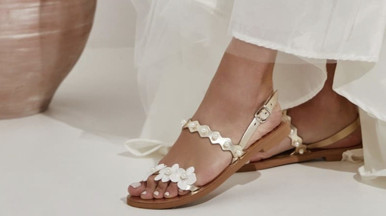 Floral sandals worn by bride