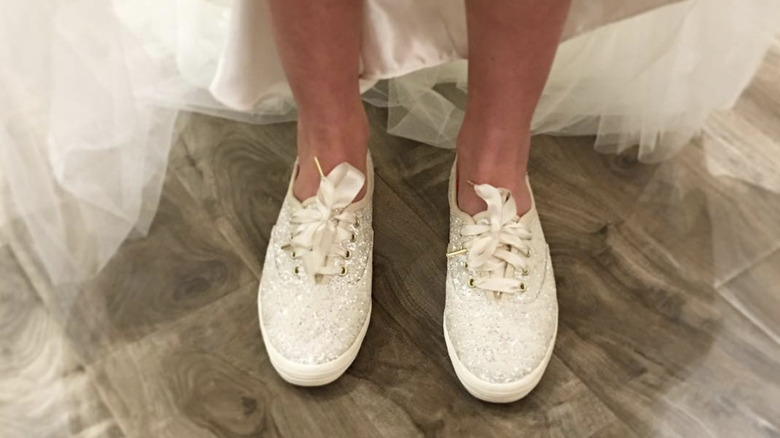 Bride wears sparkly Keds under wedding dress