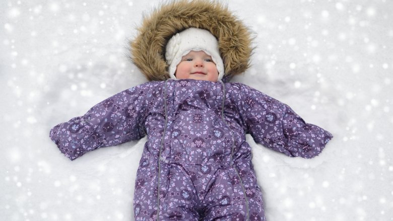 little girl in snowsuit