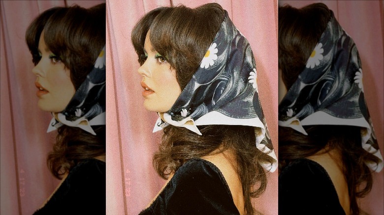 brunette wearing babushka headscarf