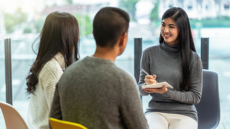 therapist with couple talking