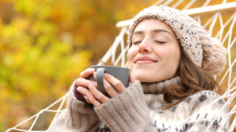 woman relaxing in hammock