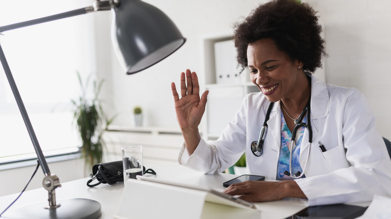 doctor telemedicine screen smiling