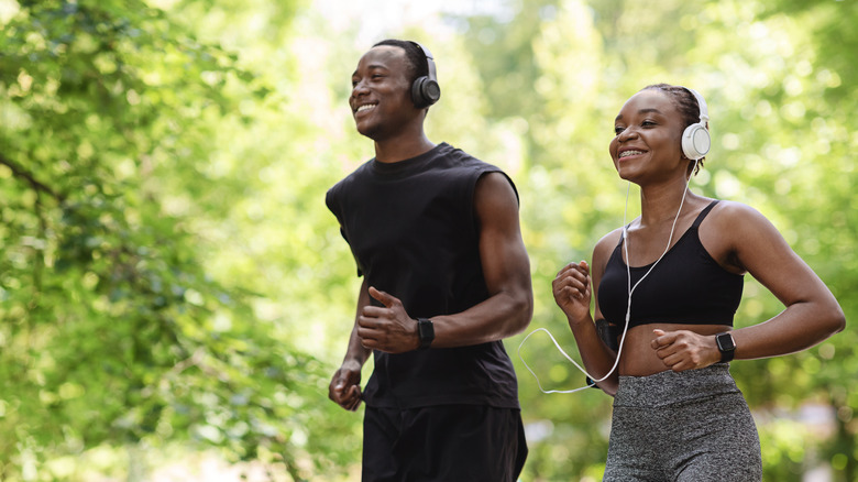 Two people running together