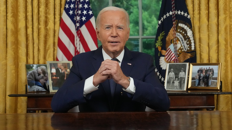 Joe Biden sitting in the Oval Office