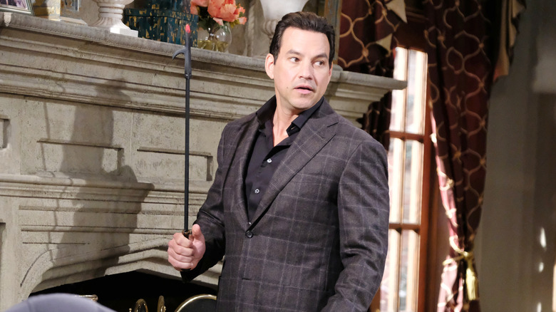 Soap Star Tyler Christopher preparing a fireplace