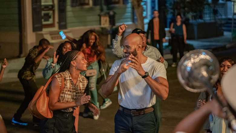 Joy Bryant and Henry Simmons laughing with the Cherish the Day crew