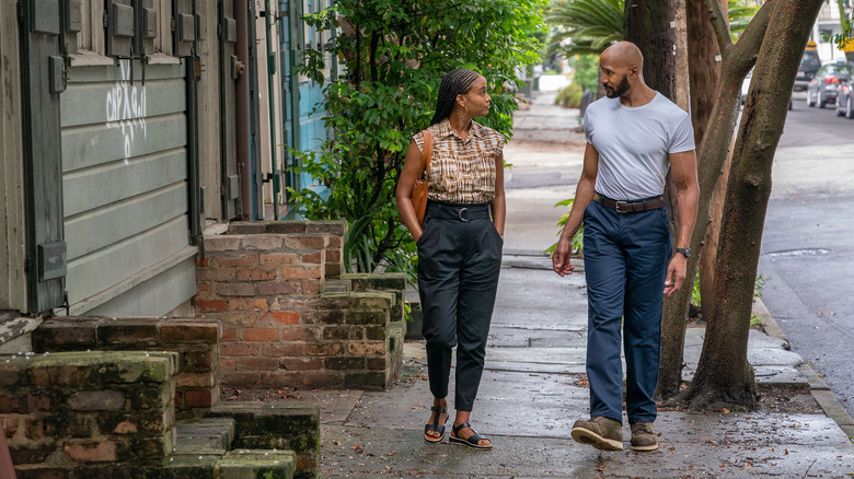 Henry Simmons and Joy Bryant walking on street in "Cherish the Day"