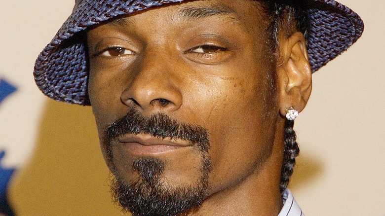 Snoop Dogg wearing a tweed hat