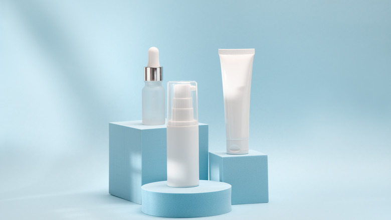 Skincare products on blue display stands