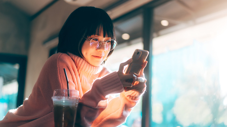 Asian woman on her phone