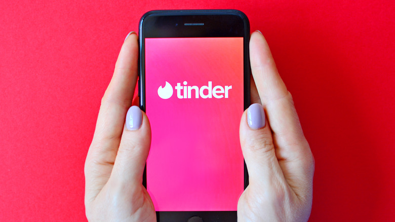 Woman looking at Tinder app