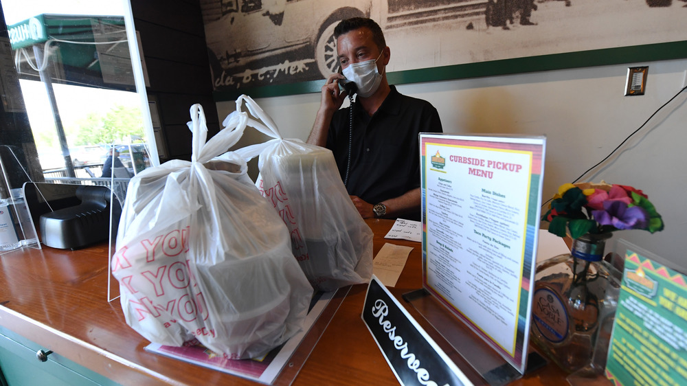 Man getting takeout orders