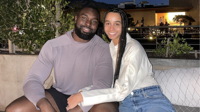 Hakeem Adeniji and his wife, Kayla, smiling 