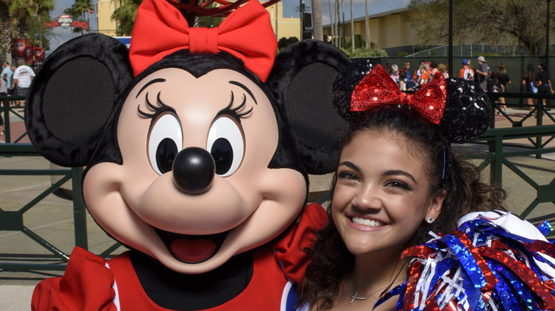 Laurie Hernandez posing with Minnie Mouse