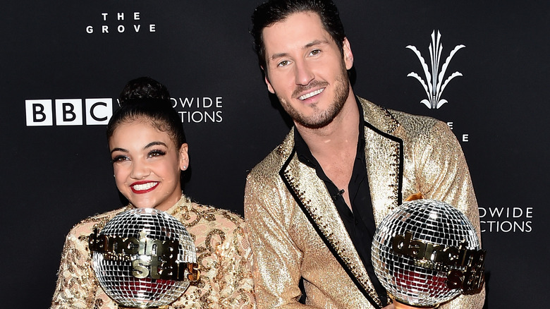 Laurie Hernandez and Val Chmerkovskiy with trophy