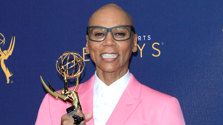 RuPaul poses with his Emmy award