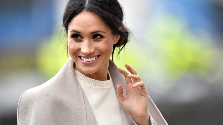 Meghan Markle waving and smiling