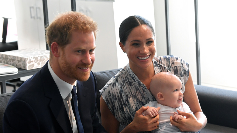 Harry Meghan and Baby Archie smiling