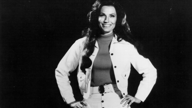 Loretta Lynn smiling with hands on hips