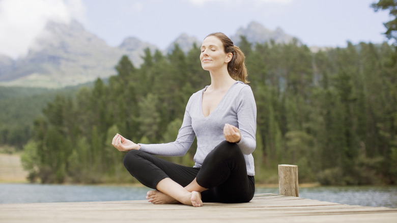 Woman meditating outside