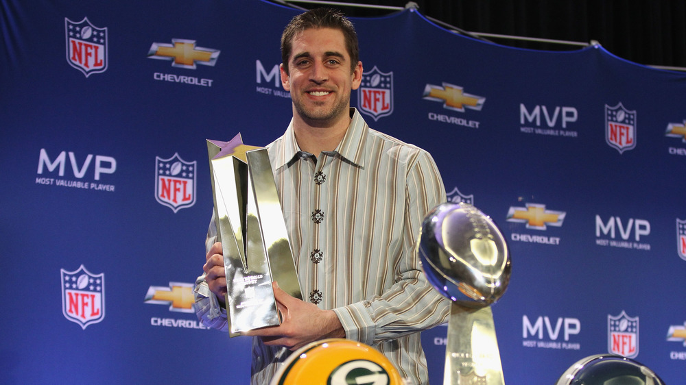 Aaron Rodgers poses with his trophy