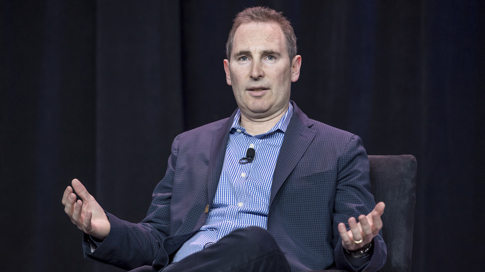 Andy Jassy gesturing on stage