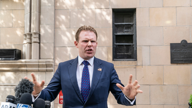 Andrew Giuliani speaking outside his father's building