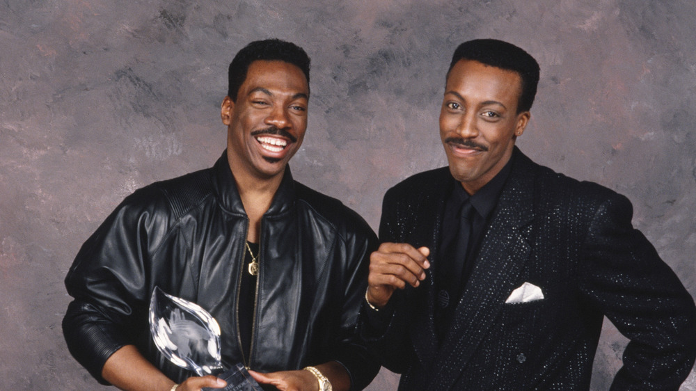 Arsenio Hall and Eddie Murphy smiling together