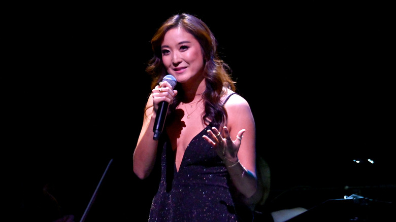 Ashley Park with a microphone