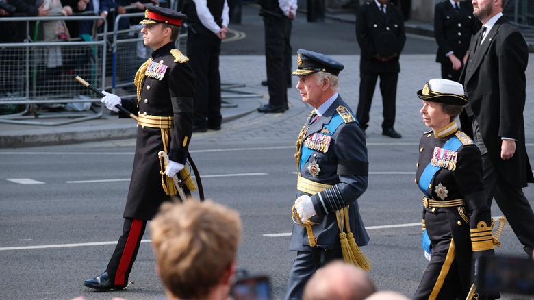 King Charles marching in funeral procession