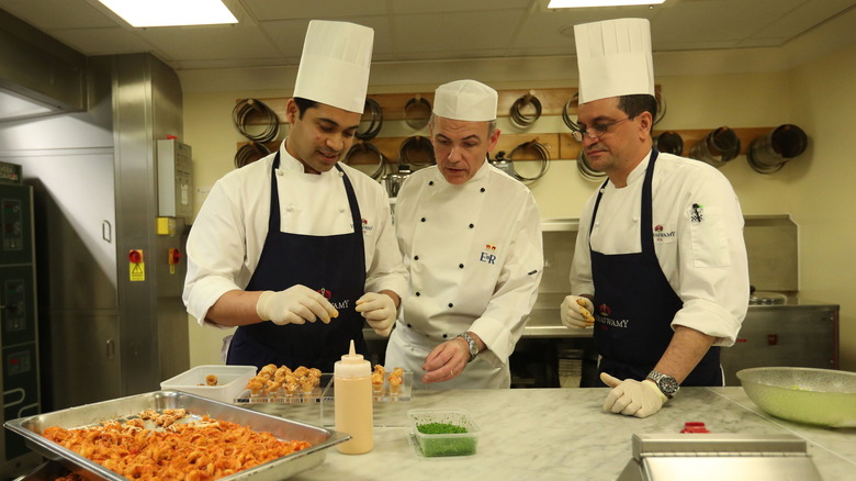 Chefs working in kitchen