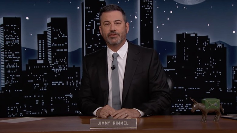 Jimmy Kimmel at his desk on Jimmy Kimmel Live!