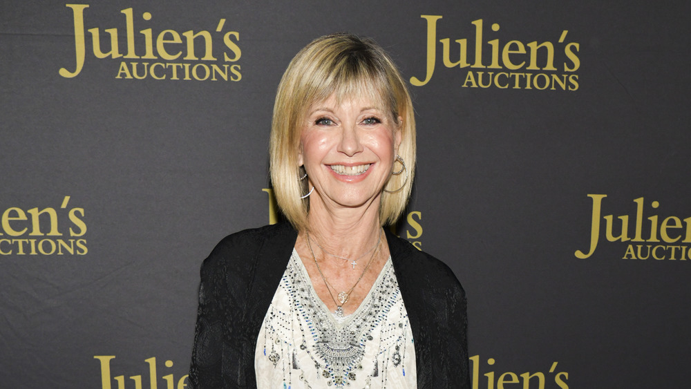 Olivia Newton-John smiles at event