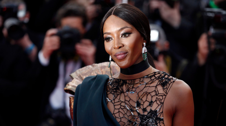 Naomi Campbell wearing black choker and hair back