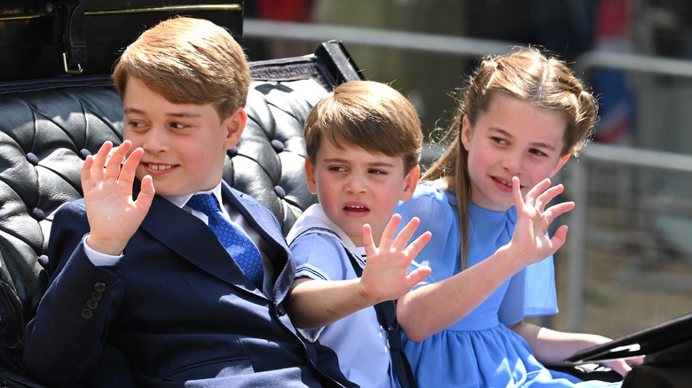 The Wales children waving in carriage 