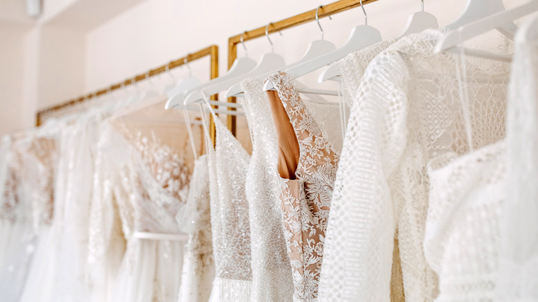 bridal dresses hanging in a showroom