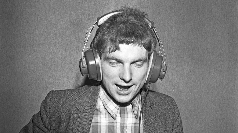 Young Van Morrison wearing headphones