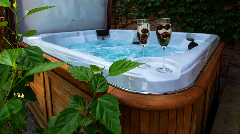 Hot tub with glasses of wine