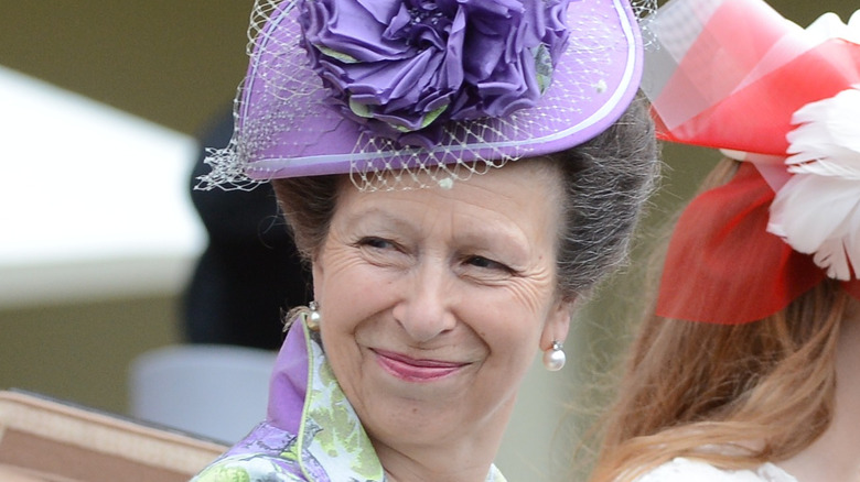 Princess Anne in a purple hat